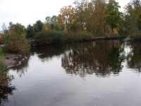 The canal continues under the bridge at left